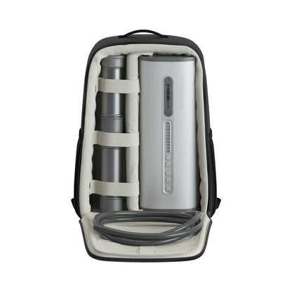 Backpack with electronic male masturbator inside on a white background